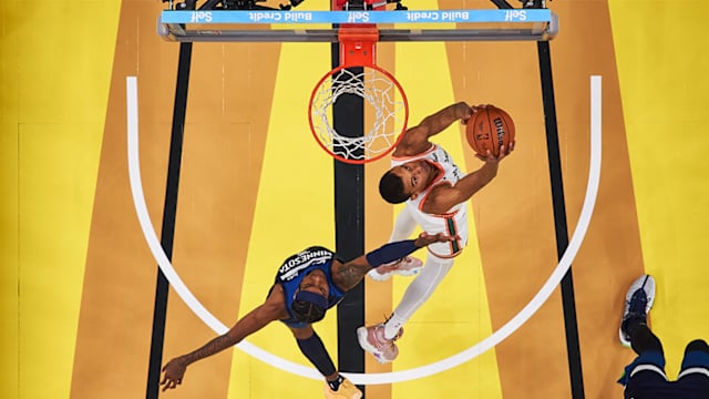 The Spurs’ Victor Wembanyama drops a reverse slam dunk vs. Minnesota.